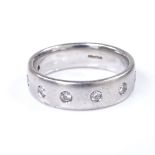 A platinum diamond set wedding band ring, total diamond content approx 0.35ct, band width 6mm,