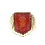 An Antique unmarked gold carnelian intaglio seal ring, with castle emblem and "Inter Primos"