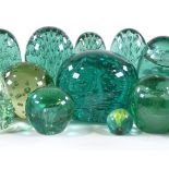 A collection of 18 Victorian green bubble glass dump weights, some with floral motifs (18)