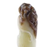 A Chinese 2-colour jade octopus, surmounted by monkey figures, length 10cm