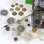 A collection of coins and tokens, including some silver