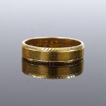 An 18ct gold wedding band ring, band width 4.7mm, size Q, 4.9g