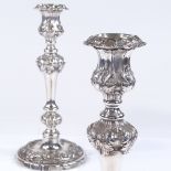 A pair of Victorian silver plated candlesticks, with all over acanthus leaf decoration and removable