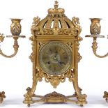 An ornate 19th century gilt-bronze cased 3-piece clock garniture, with engraved brass dial and 8-day