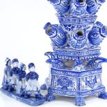 A large Delft Pottery blue and white table centre flower stand, height 54cm, and a Delft group of