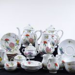 A Limoges porcelain wild flower design tea and coffee service, including 2 teapots, a coffee pot,