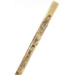 A Chinese cylindrical ivory pen holder, finely engraved with figures in gardens, probably early 20th