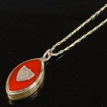 A Victorian gilt-metal and carnelian pendant photo locket, on a gilt-metal chain, locket height 29.