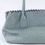 A Francesco Biasia woven mint green handbag