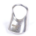 A Finnish sterling silver ring? with stylised open work settings, marks for Turku of Finland,