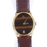 An 18ct gold Baume & Mercier Baumatic Automatic wristwatch, Tiger's Eye effect dial and date