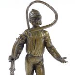 A bronze standing figure of a huntsman holding a whip, unsigned, on wood plinth, overall height 19cm