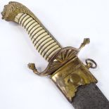 A Georgian Naval Officer's dirk, with gilt-brass lion head pommel and etched blade, with gilt-