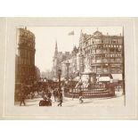 A small album of original late 19th century photographs depicting London street scenes, album size