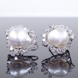 A pair of 18ct white gold pearl and diamond cluster clip earrings, total diamond content approx 3ct,