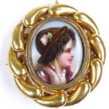 A Victorian miniature painted portrait on porcelain, depicting a young boy, in unmarked yellow metal