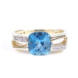A 9ct gold blue topaz and diamond dress ring, topaz length 8mm, size P, 3.9g