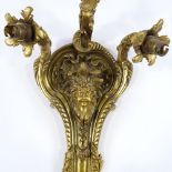 A 19th century French bronze triple light wall sconce, relief cast mask decoration, height approx