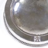 A circular silver-mounted ashtray, with reeded border, by Albert Edward Jones, hallmarks