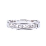 A platinum and diamond half eternity band ring, Princess-cut diamond content approx 0.5ct, setting