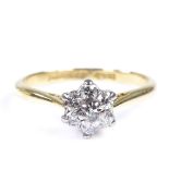 An 18ct gold diamond cluster flowerhead ring, setting height 7.6mm, size N, 2.7g