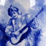 A large Royal Doulton pottery vase, blue transfer design of young woman playing a guitar, height