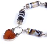 A Scottish banded agate and unmarked silver heart lock bracelet, with 6 panel body and photo panel