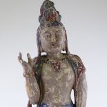 An Indian carved and painted wood standing figure, height 78cm
