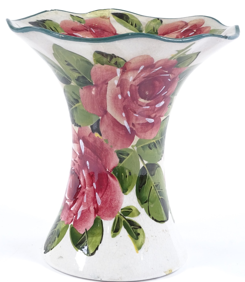 A Wemyss Pottery vase with flared rim and hand painted rose decoration, painted marks under base,