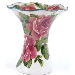 A Wemyss Pottery vase with flared rim and hand painted rose decoration, painted marks under base,