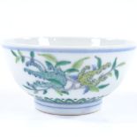 A Chinese porcelain bowl with hand painted fruit decoration and 6 character mark, diameter 11cm