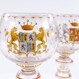 A pair of Continental glasses with painted armorial decoration, height 24cm