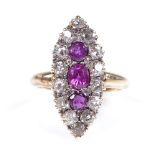 An 18ct gold ruby and diamond cluster marquise-shaped ring, setting height 24.9mm, size M, 5.8g