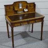 A late Victorian walnut writing table, circa 1900, with stationery rack fitted upper part, 2