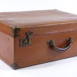 A Vintage Louis Vuitton brass-bound simulated leather suitcase, all locks and pins marked,