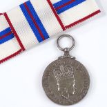 A Queen Elizabeth II Silver Jubilee medal, cased