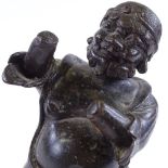 An Antique Oriental patinated bronze kneeling figure, probably 18th or 19th century, height 23cm