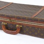 A Louis Vuitton monogram tennis racket case, 75cm x 30cm x 13cm