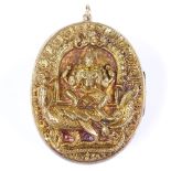 An Oriental unmarked silver-gilt high relief embossed photo locket, depicting incarnation of Ganesha