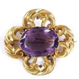 A large Victorian amethyst brooch, with unmarked yellow metal pierced frame, length 45.8mm, 17.5g