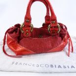 A Francesco Biasia metallic red handbag, with dust bag