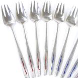 A set of 12 sterling silver and enamel pastry forks, with inlaid red and blue enamelling, length