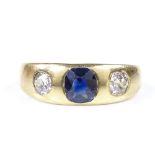An unmarked gold 3-stone blue stone and diamond ring, setting height 6.6mm, size Q, 3.9g