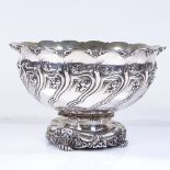 A Tiffany & Co. sterling silver circular punch bowl, with relief embossed leaf and foliate body,