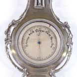 A small silver banjo-shaped barometer / thermometer, with pierced foliate surround, by Henry