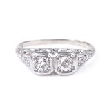An 18ct white gold 2-stone diamond dress ring, with diamond set shoulders and pierced bridge,