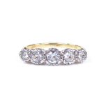 An 18ct gold 5-stone graduated diamond ring, central stone approx 0.21ct, total diamond content