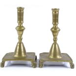 A pair of Spanish brass candlesticks, circa 1700, on square bases, height 21cm