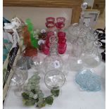 Cranberry goblets, Art Deco table centre figures, grapes, and other glassware