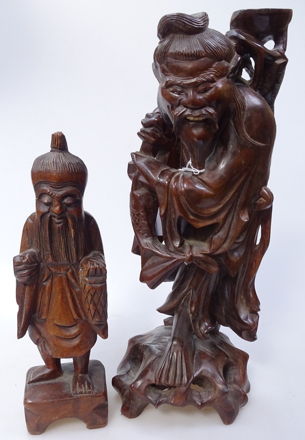 2 Chinese carved and stained wood standing figures, largest height 35cm